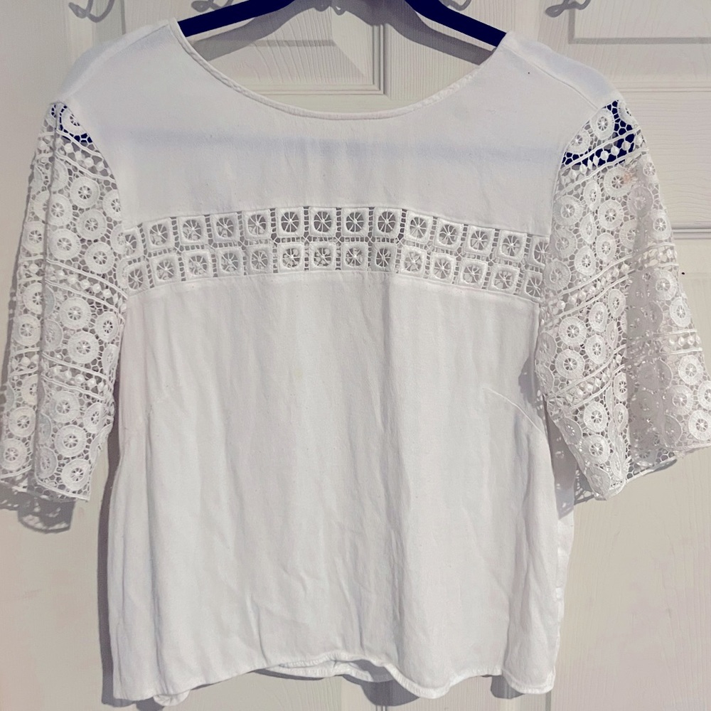 Medium, white blouse.